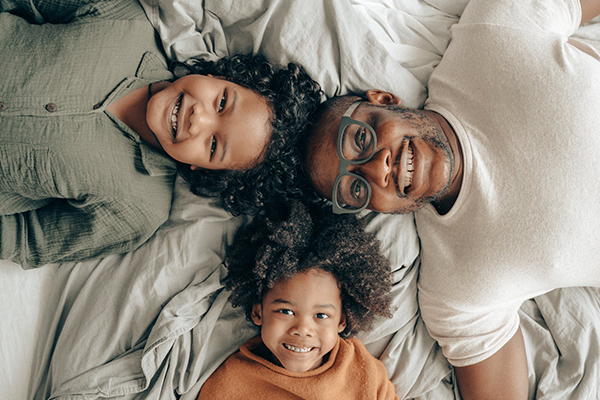 Happy family looking at the camera